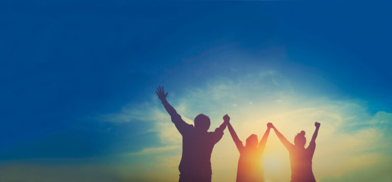 Silhouette,Of,Happy,Teamwork,Hold,Hands,Up,As,A,Business